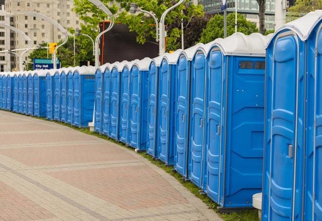 a row of portable restrooms at a fairground, offering visitors a clean and hassle-free experience in chimayo